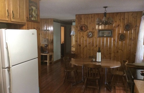 Nevis House | Family-Friendly Lakeside Retreat with Pool & Pet Amenities