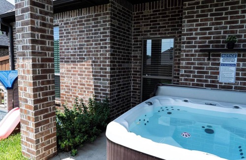 Tyler House | Family Fun 3BR Getaway with Hot Tub and Play Yard