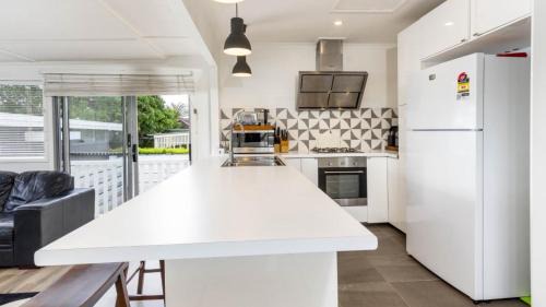 Banksia Beach House | Family Retreat with Pool & Guest House for Your Getaway