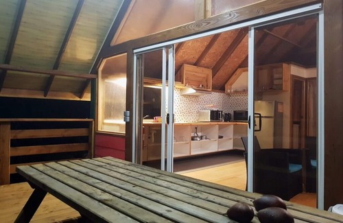 Teahupoo House | Discover Fare Ora: Nestled in a Serene Wooded Park