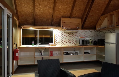 Teahupoo House | Discover Fare Ora: Nestled in a Serene Wooded Park