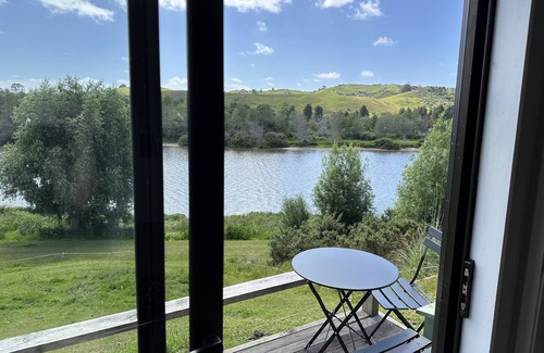 Pukekawa Cabin | Idyllic Farm Shack with River & Sunset Views, Rated 10/10