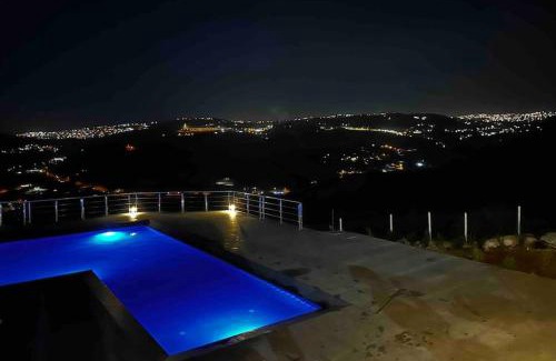 Suwailih Villa | Inviting Farmhouse Retreat with Pool and Oceanfront Views