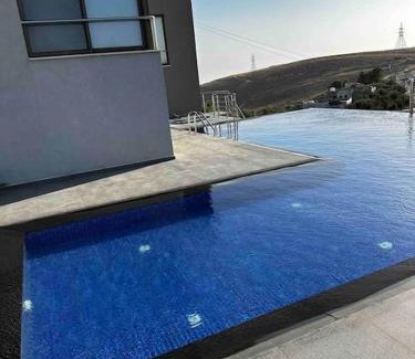 Suwailih Villa | Inviting Farmhouse Retreat with Pool and Oceanfront Views