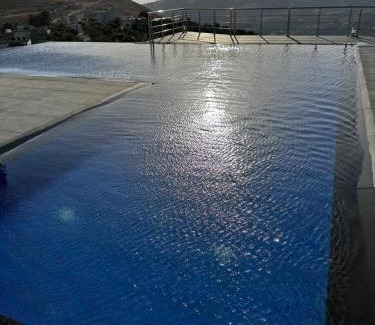 Suwailih Villa | Inviting Farmhouse Retreat with Pool and Oceanfront Views