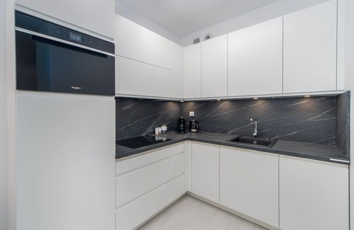 West Pomeranian Voivodeship Apartment | Faro Nadmorskie Tarasy SPA: Poolside Retreat by the Sea