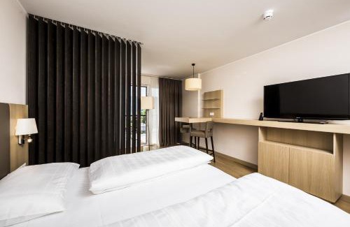 Krumpendorf am Woerther See Apartment | Relax at Feel Good Resort: Pet-Friendly Oasis with Spa