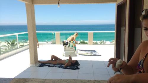 Itauna Bed & Breakfast | Relax at Felicidade: Beachfront Stay with Hot Tub Access