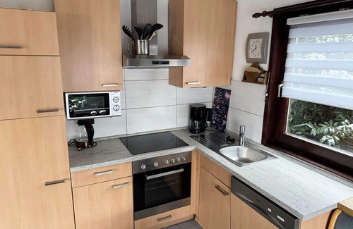 Feriendorf Hennesee House | Idyllic Holiday Home on Lake Henne with Pet-Friendly Terrace