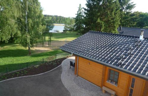 Mecklenburgische Kleinseenplatte House | Relaxing Retreat at Ferienhaus am See in Fleeth with Hot Tub