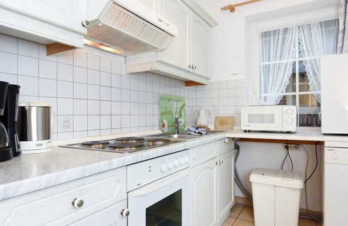 Dunum Apartment | Ocean View Getaway at Ferienwohnung Löwenzahn