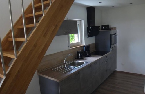 Sirzenich Apartment | Ocean-View Retreat: Ferienwohnung Moni with Kitchen Amenities