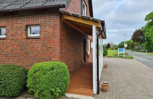 Nordleda Apartment | Cozy Ferienwohnung Sabrina: Poolside Retreat for Families