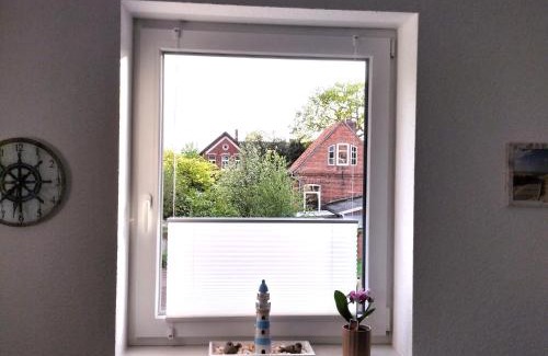 Norden Apartment | Family-Friendly Retreat at Ferienwohnung Windkunst with Hot Tub