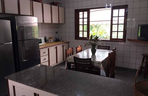 Morro da Cruz Cottage | Inviting Field and Sea: Oceanfront Retreat with Spa & Pool