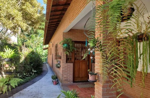 Morro da Cruz Cottage | Inviting Field and Sea: Oceanfront Retreat with Spa & Pool