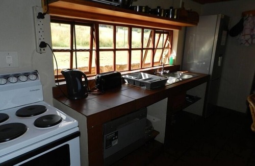 Dullstroom Cottage | Unwind at Field and Stream: Pet-Friendly with Pool & Dining