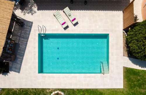 Pastida Villa | Experience Filerolia Stone House: Oceanfront with Pool