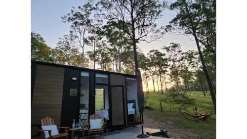 Girvan House | Delight in the Firefly Tiny House - Rated 9.6 by Guests