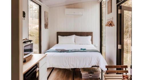 Girvan House | Delight in the Firefly Tiny House - Rated 9.6 by Guests