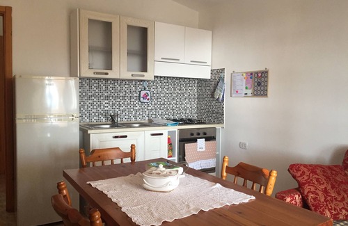 Sarroch Apartment | Oceanfront Apartment with Sea View Veranda in Porto Columbu