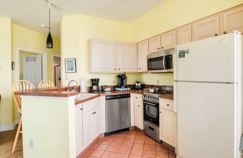 Manistee Condo | Inviting First Floor Condo at Water's Edge with Lake Views