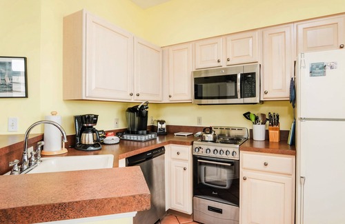 Manistee Condo | Inviting First Floor Condo at Water's Edge with Lake Views