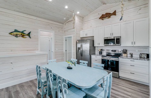 Palm Harbor House | Seaside Retreat: Poolside Bliss, Steps to Dining & Fun!