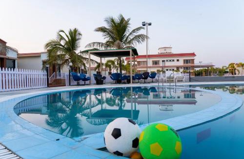 Una Hotel | Explore Flamingo Club and Resort Near Diu with Pool Access