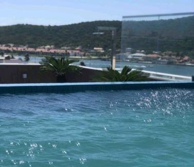 Passagem Apartment | Cozy Flat 313 Steps from Praia do Forte with Pool & Spa