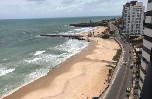 Areia Preta Apartment | Oceanfront Retreat: Guest Rated 9.6 with Pool & Pet-Friendly