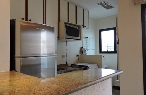 Pitangueiras Apartment | Beautiful Flat in Guarujá Steps from the Beach with Pool