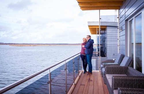 Kroeslin Boat Rental | Cozy Floating House Nr. 6 Idun with Ocean View & Spa