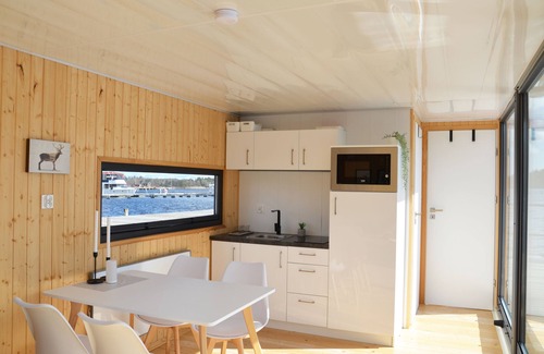 Blankaholm Boat Rental | Waterfront Floating House with Unobstructed Views in Sweden