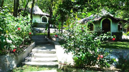 Ranong Resort | Relax at Flower Power Farm Village: Pool & Oceanfront Bliss