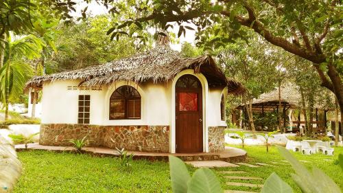Ranong Resort | Relax at Flower Power Farm Village: Pool & Oceanfront Bliss