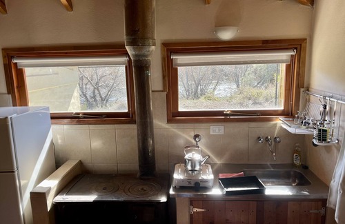 Junin de los Andes Cabin | Cozy Fly Fishing Cabin with Lake View and Spa Amenities