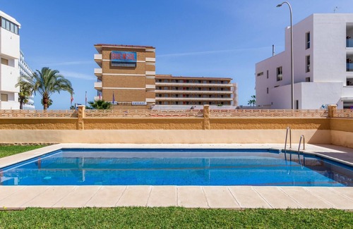 Carihuela Apartment | Fontana: Beachside Retreat with Pool and Sea Views
