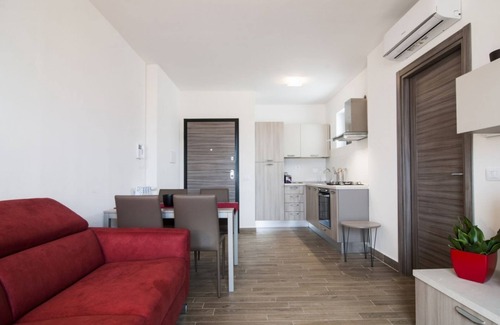 Centro Giano Apartment | Inviting Fonte Laurentina RED Apartment with Family Amenities