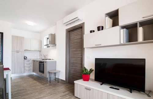 Centro Giano Apartment | Inviting Fonte Laurentina RED Apartment with Family Amenities