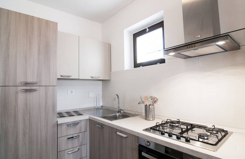 Centro Giano Apartment | Inviting Fonte Laurentina RED Apartment with Family Amenities