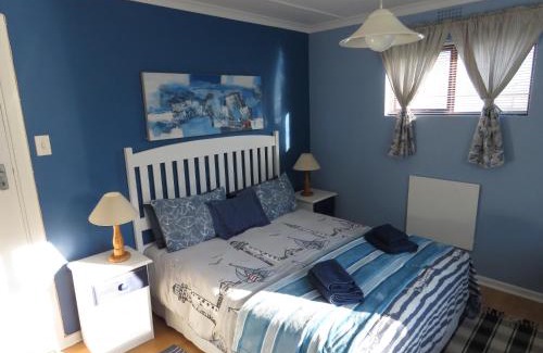 Old Place Apartment | Discover Footprints of Knysna: Poolside Retreat with Top Reviews