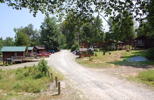 Advance Resort | Relax at Forest Lake Camping Resort Cabin 18 with Hot Tub