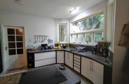 Florianopolis Bed & Breakfast | Foresthouse Hostel and Events: Relax by the Oceanfront Pool