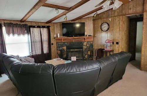 Moodys House | Forget your worries in this spacious and serene lake house in the woods