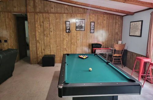 Moodys House | Forget your worries in this spacious and serene lake house in the woods