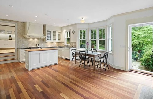 New Canaan House | Inviting Fountain Courtyard with Ocean View & Fireplace Kitchen