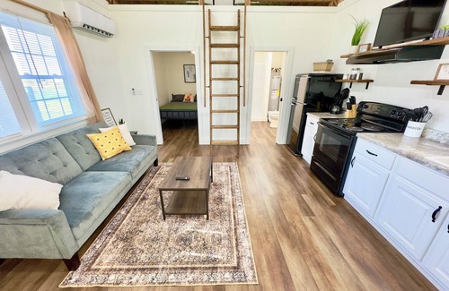 Guntersville Cabin | Cozy Fox Tiny Cabin on Lake with Bouncy House & Spa