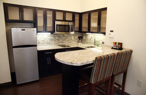 Minot Apartment | Enjoy Free Breakfast, Pool & Gym for Business Travelers