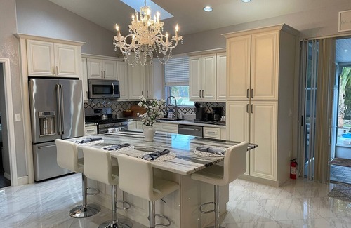 Golf and Sea Village of Apollo Beach House | Inviting Retreat with Heated Pool, Games & Ocean Views